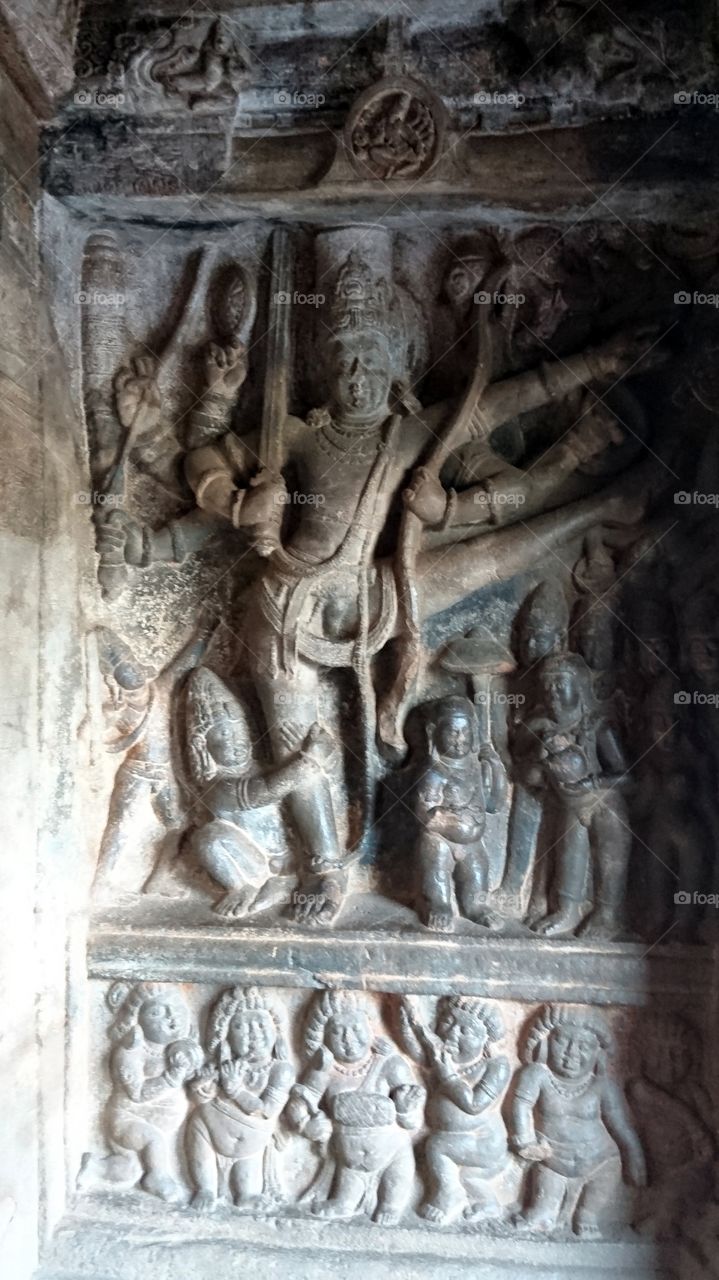 Badami cave complex - sculptures represents 3rd incarnation of vishnu avatar, vamana - expanding into tivikirama - measuring three world