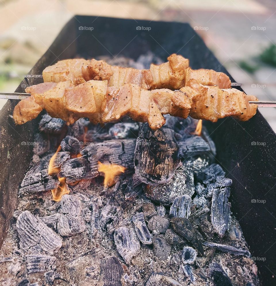 Cooking meat on the brazier