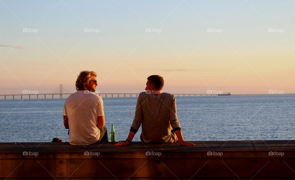 Friends enjoying the sunset in Malmö, Sweden.