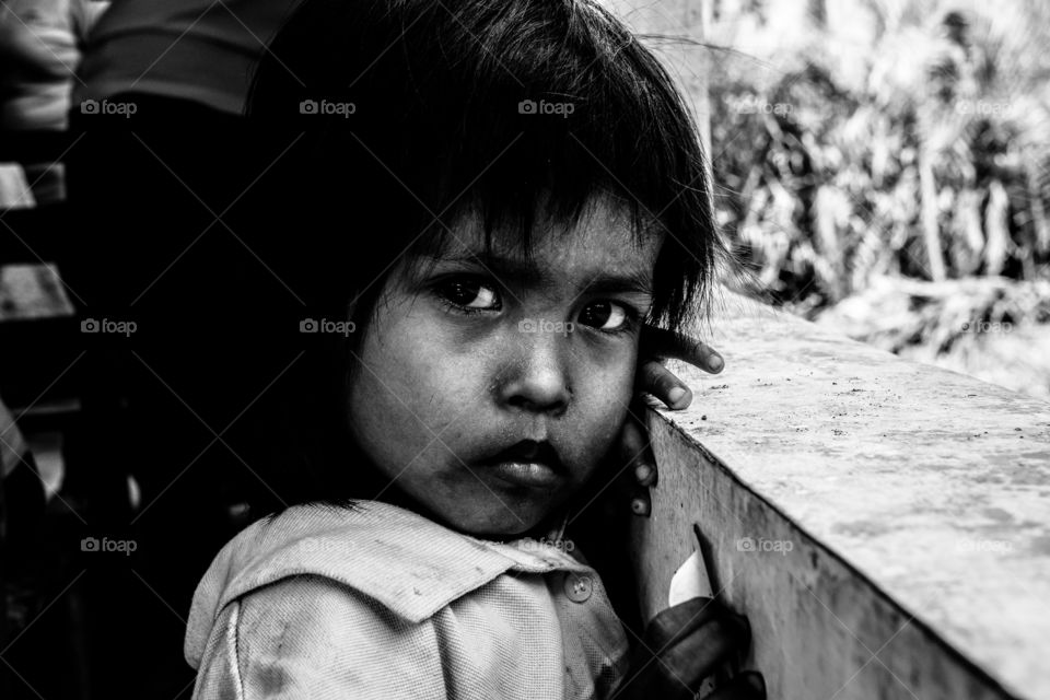 I met this little girl, I don't even know her name but when I captured this photo and I saw her eyes staring directly at me, I felt vulnerable like she was staring directly into my soul. Also, I felt scared because she's still innocent  and she's going to see or experience the cruelties in this world. I do hope she'll have a good life ahead of her. 

This is one of my favorite photos not because it's mine but because I felt something that will always be remembered.
