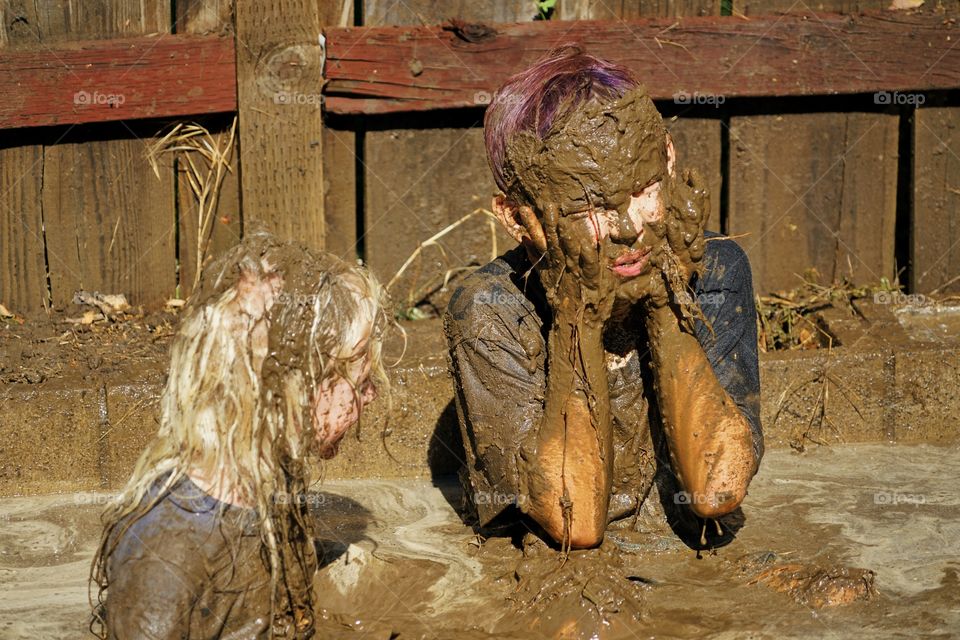 Kids Playing In Mud