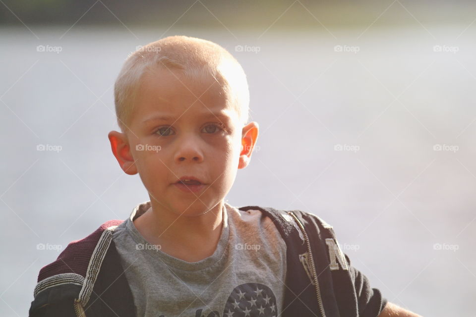 Boy portrait and summer sunset