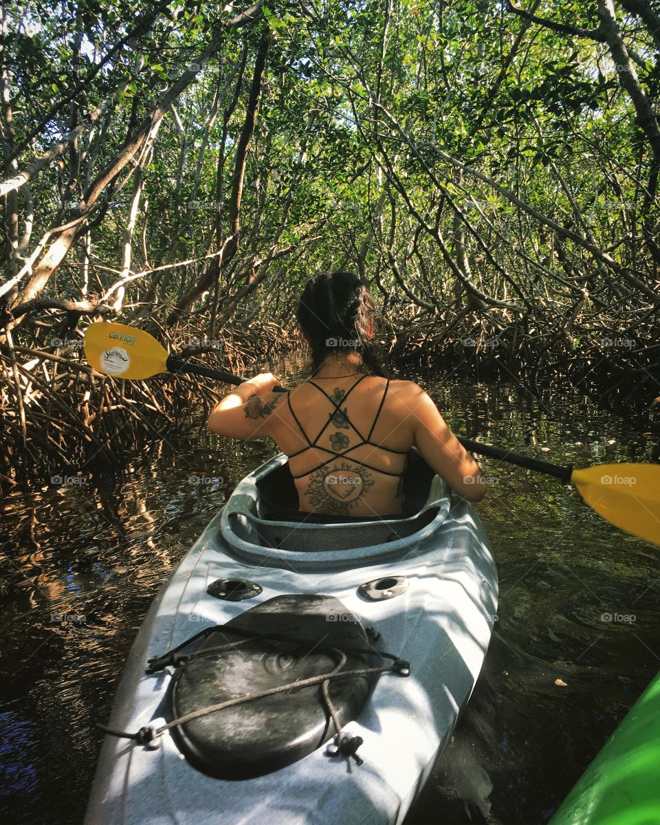 Kayaking through mangrove tunnels