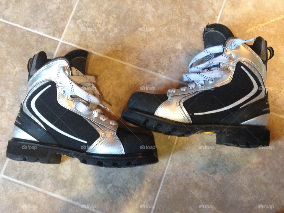 Black and silver winter hockey boots