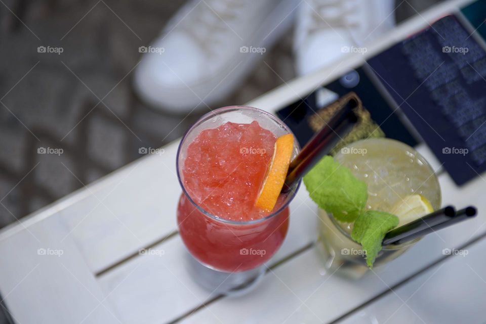Red summer soft drink in glass goblets.