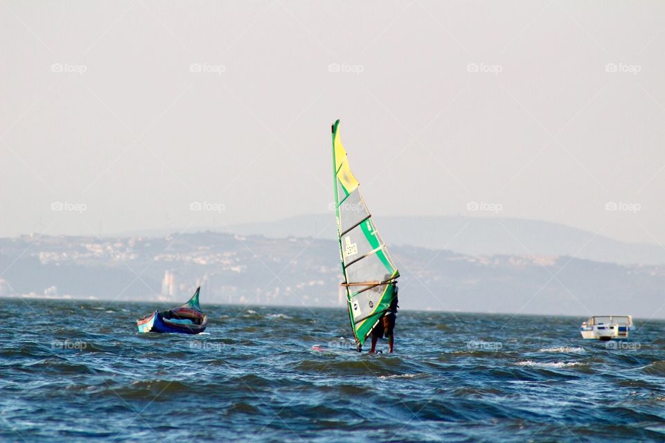 Man practicing windsurf, water sports, sports 