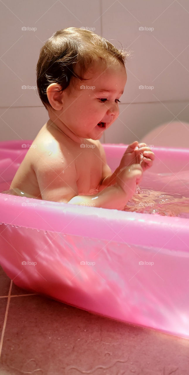 Bath time for baby girl. Nothing like playing in the tub.