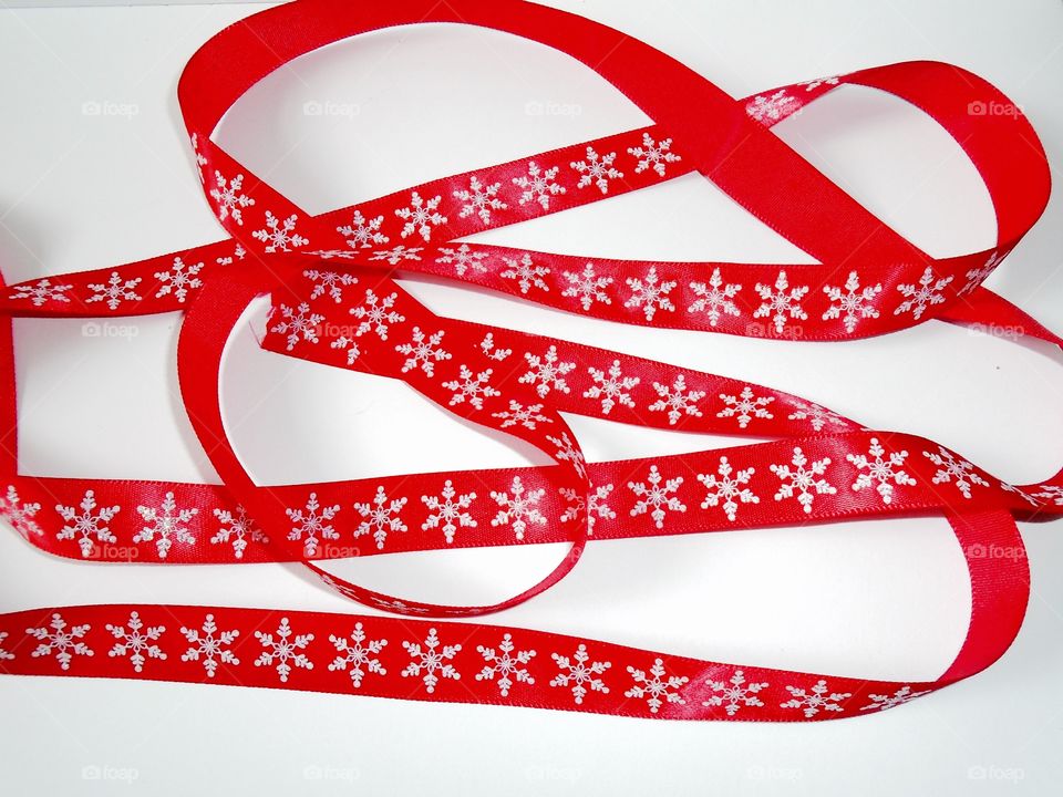 Christmas red ribbon with snowflakes 