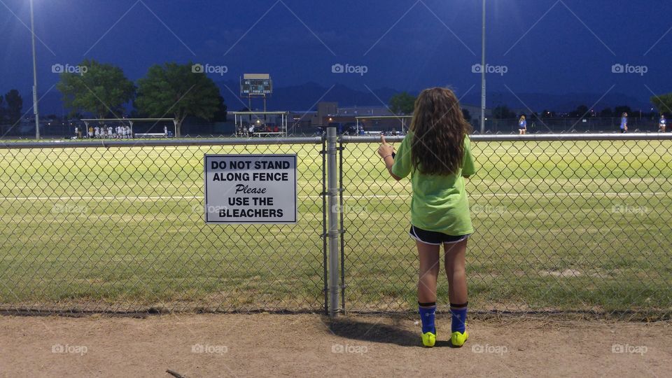 Along the Fence. Sometimes you have to get a little bit closer to watch the game.