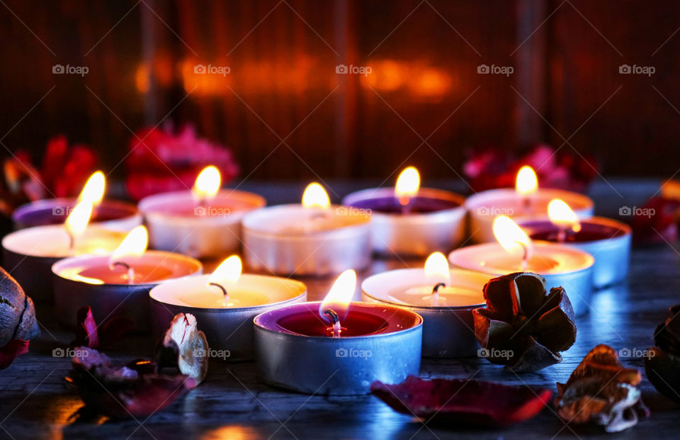 Candles and flowers in the shape of heart