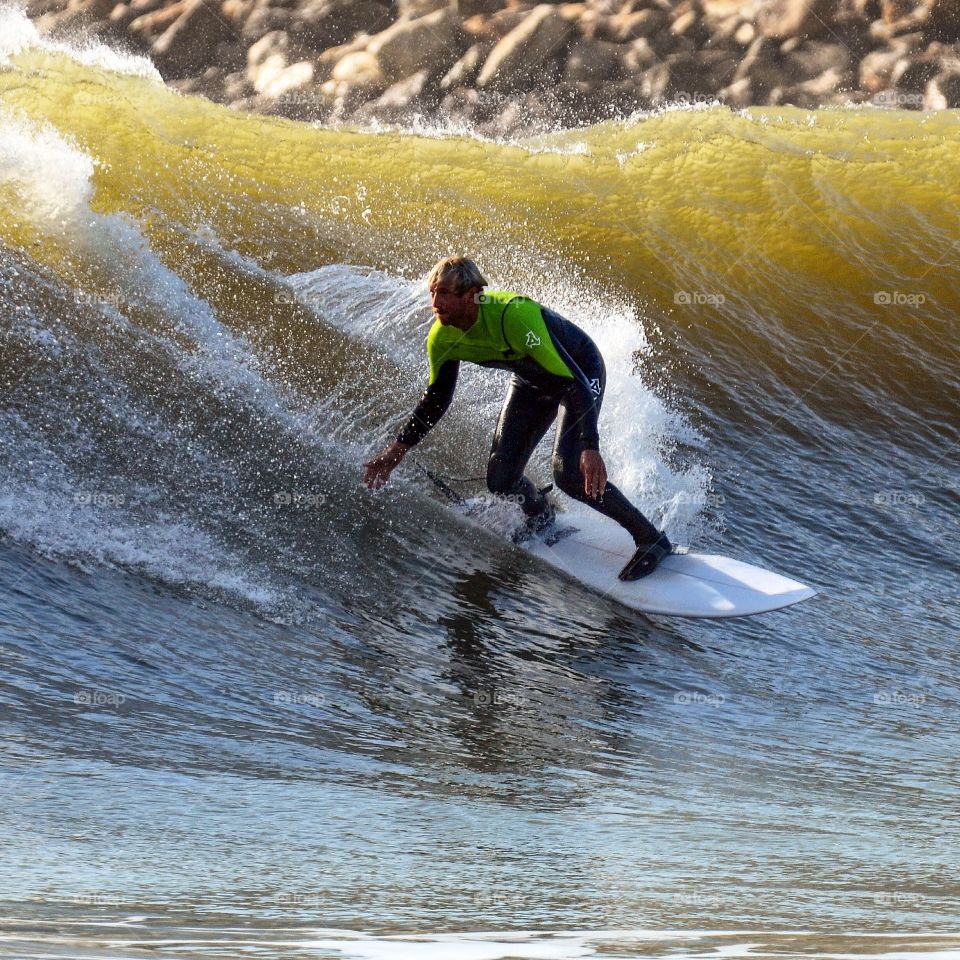 Surfer. Griffo surfing a right hander on the southcoast of Portugal
