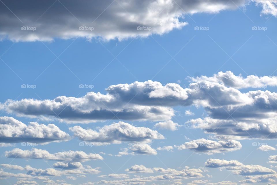 Beautiful clouds scattered under a light blue sky