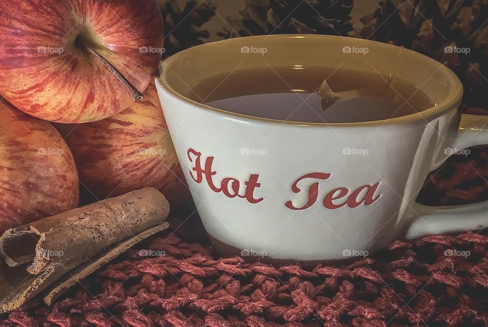 Hot apple & cinnamon tea on chunky knitwear, with fruit & spices