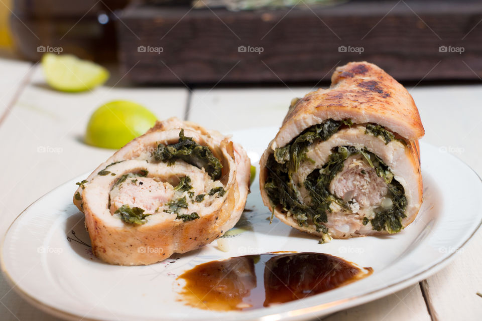 Chicken Ballotine stuffed with spinach and mozzarella.