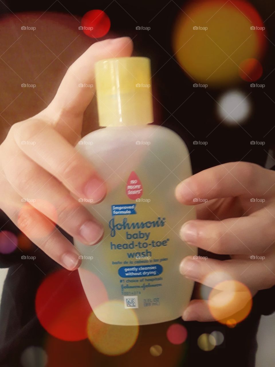 Boy Hands Holding Johnson's Baby Wash With Light Effect