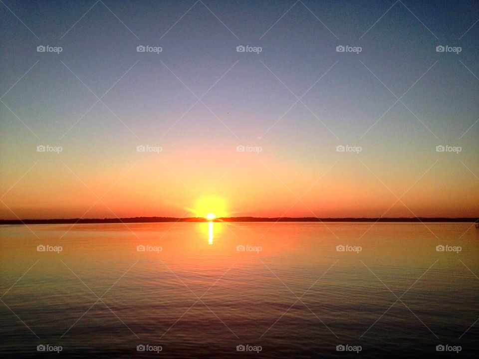 Sun coming up on Lake Kegonsa, WI.
