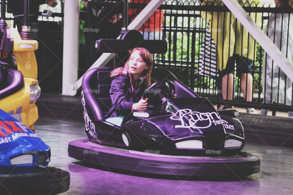 Girl driving a bumper car