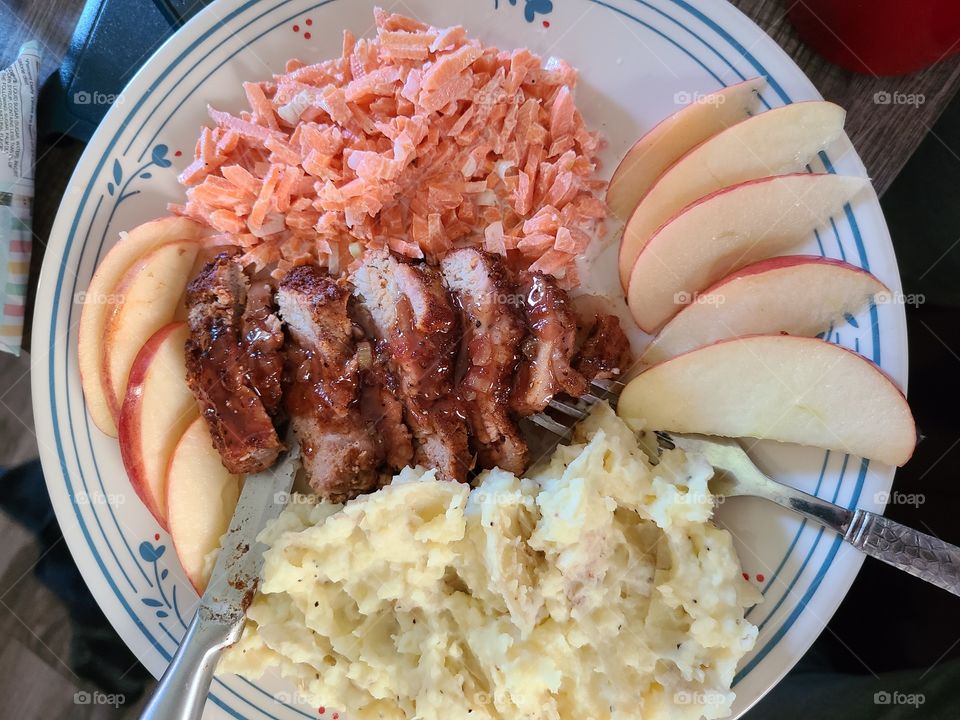 Pork with apples, potatoes, and slaw