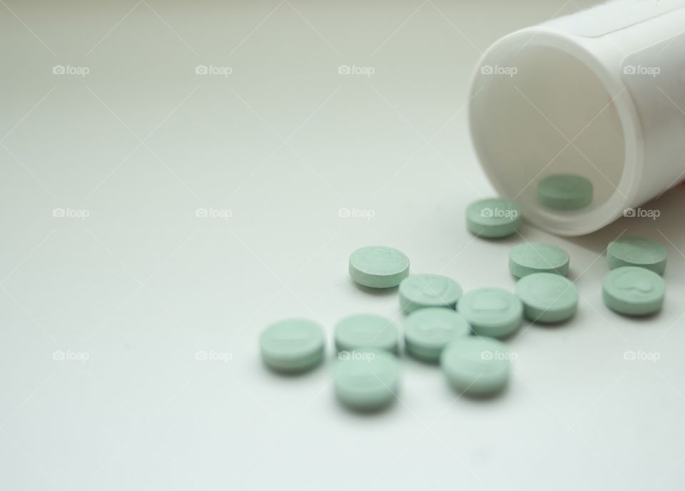 Pills spillage, isolated on white background 