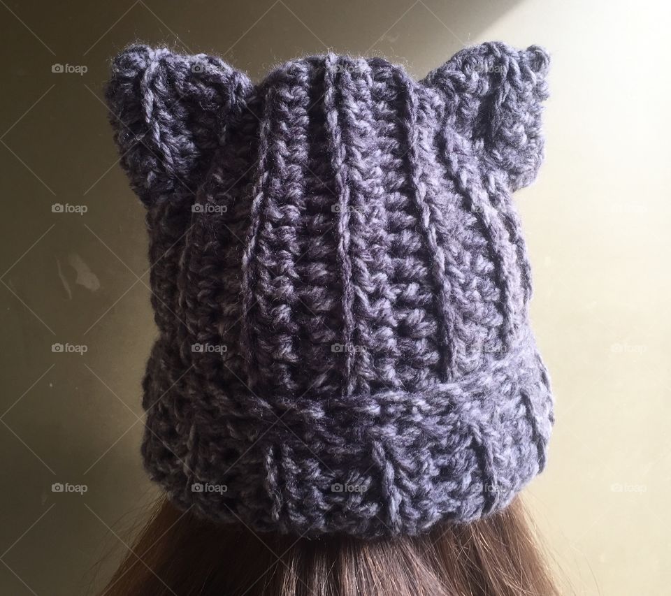 Close-up of woman head warring crochet pattern cap