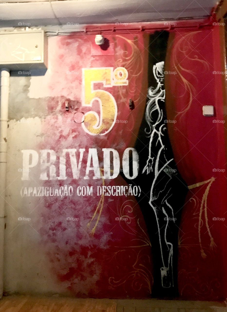 Murals on a staircase to Pensao de Amor the most famous bar in Lisbon Portugal made out of old brothel