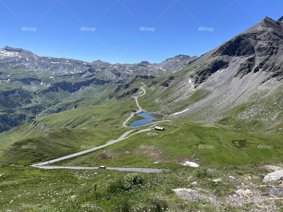 Road trip on Großglockner high alpine road  in the alps of Austria on a sunny summer day, view of mountains and road