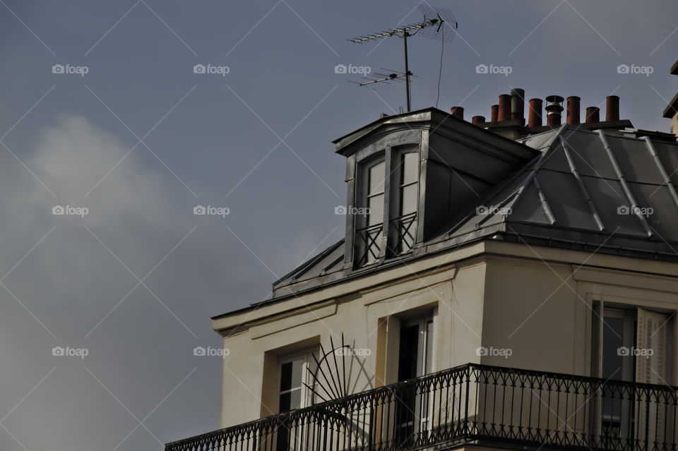 building with blue sky and clouds