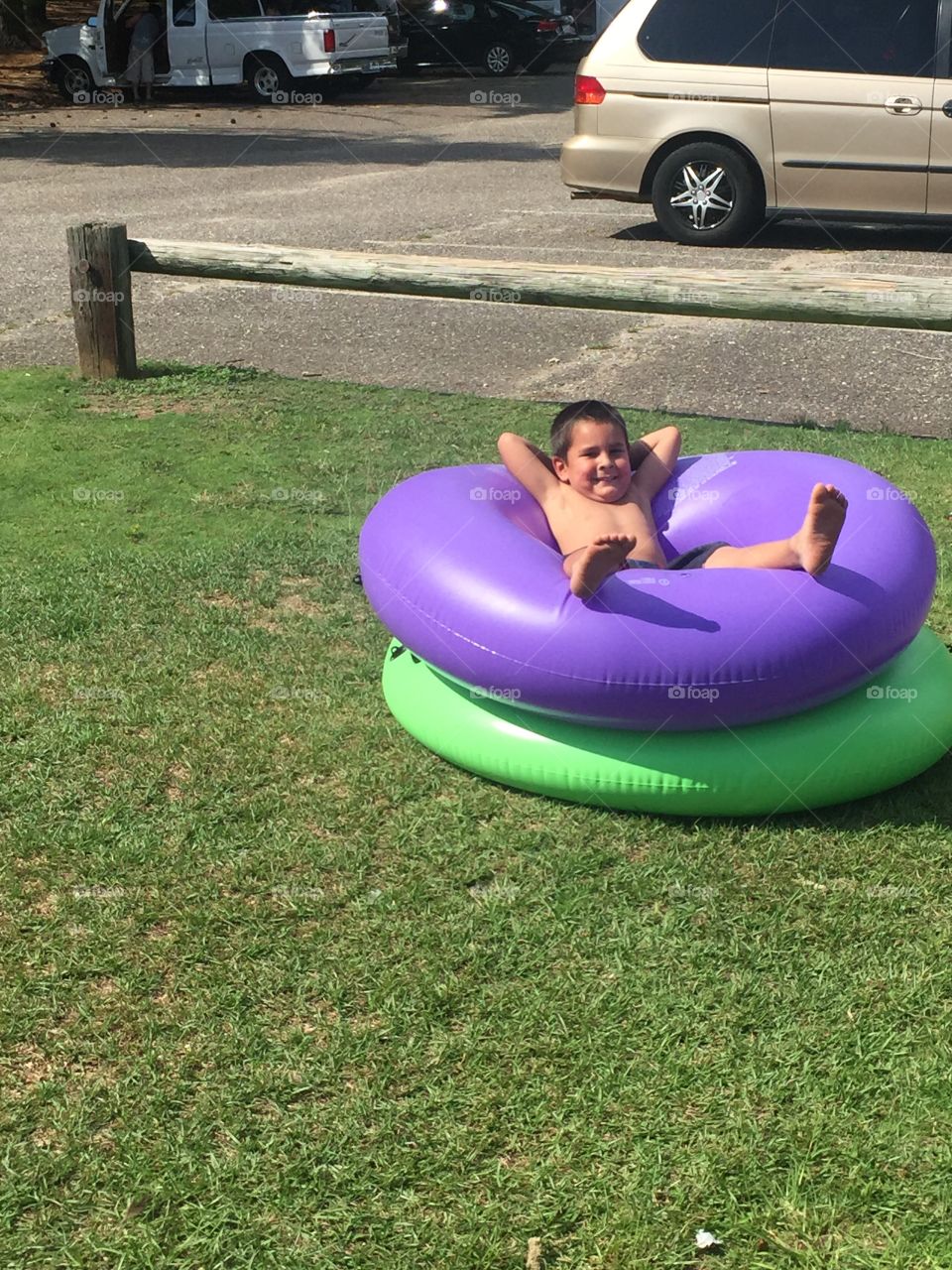 Boy relaxing at the lake on a summer day 