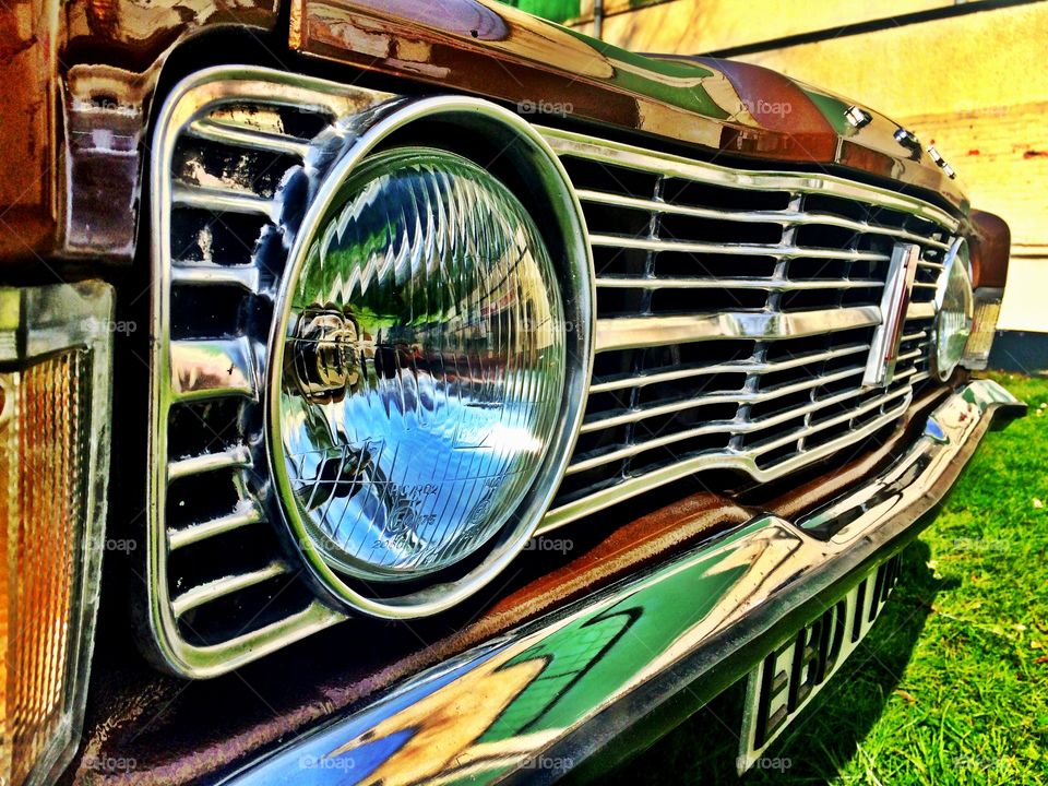 Close up of headlights on a vintage Ford Cortina