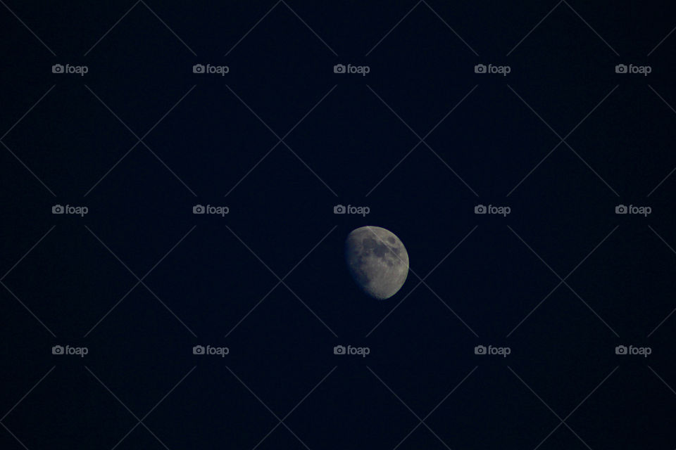 The moon against the background of the dark sky.