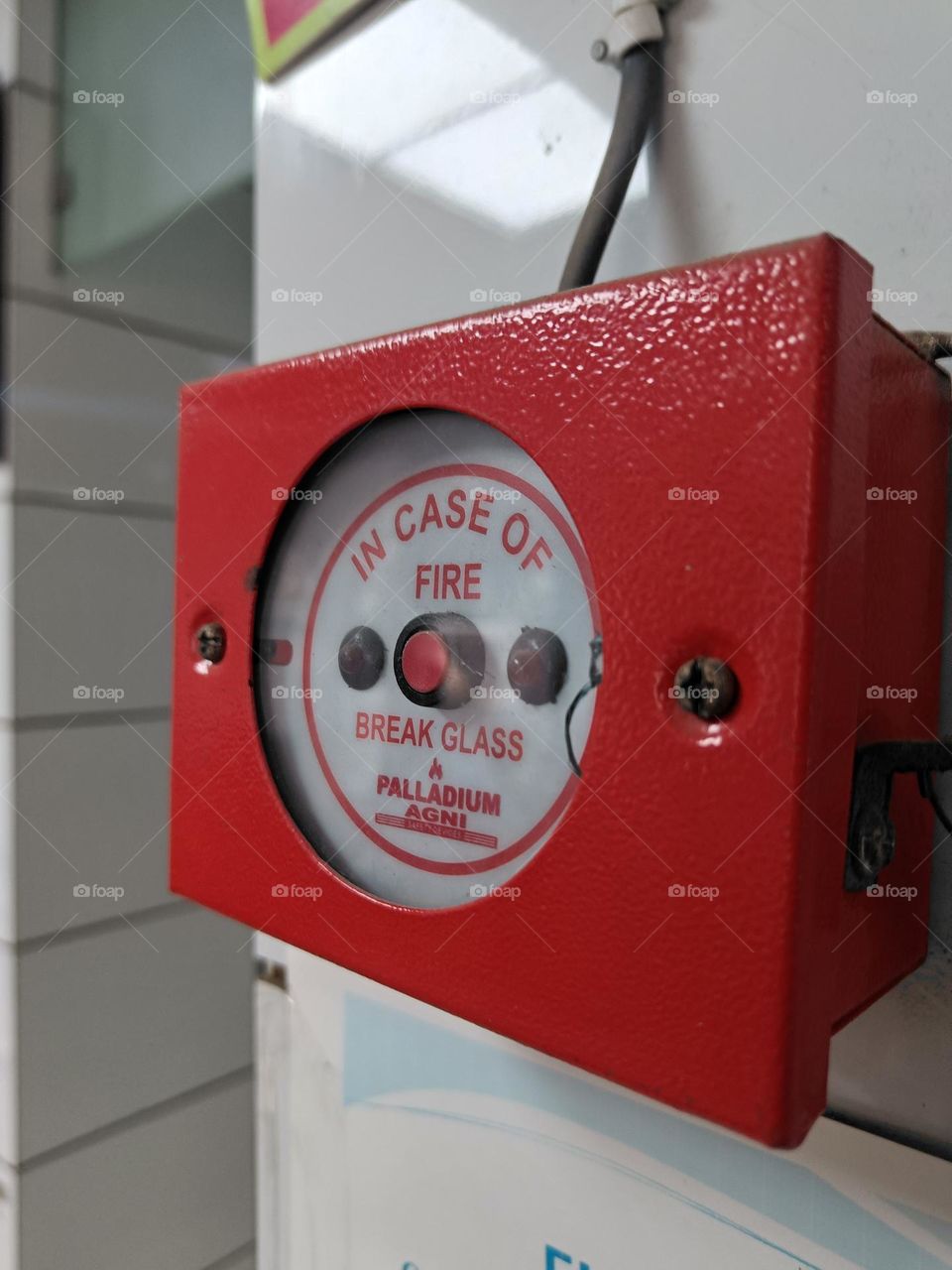 closeup photo of fire emergency alarm button.