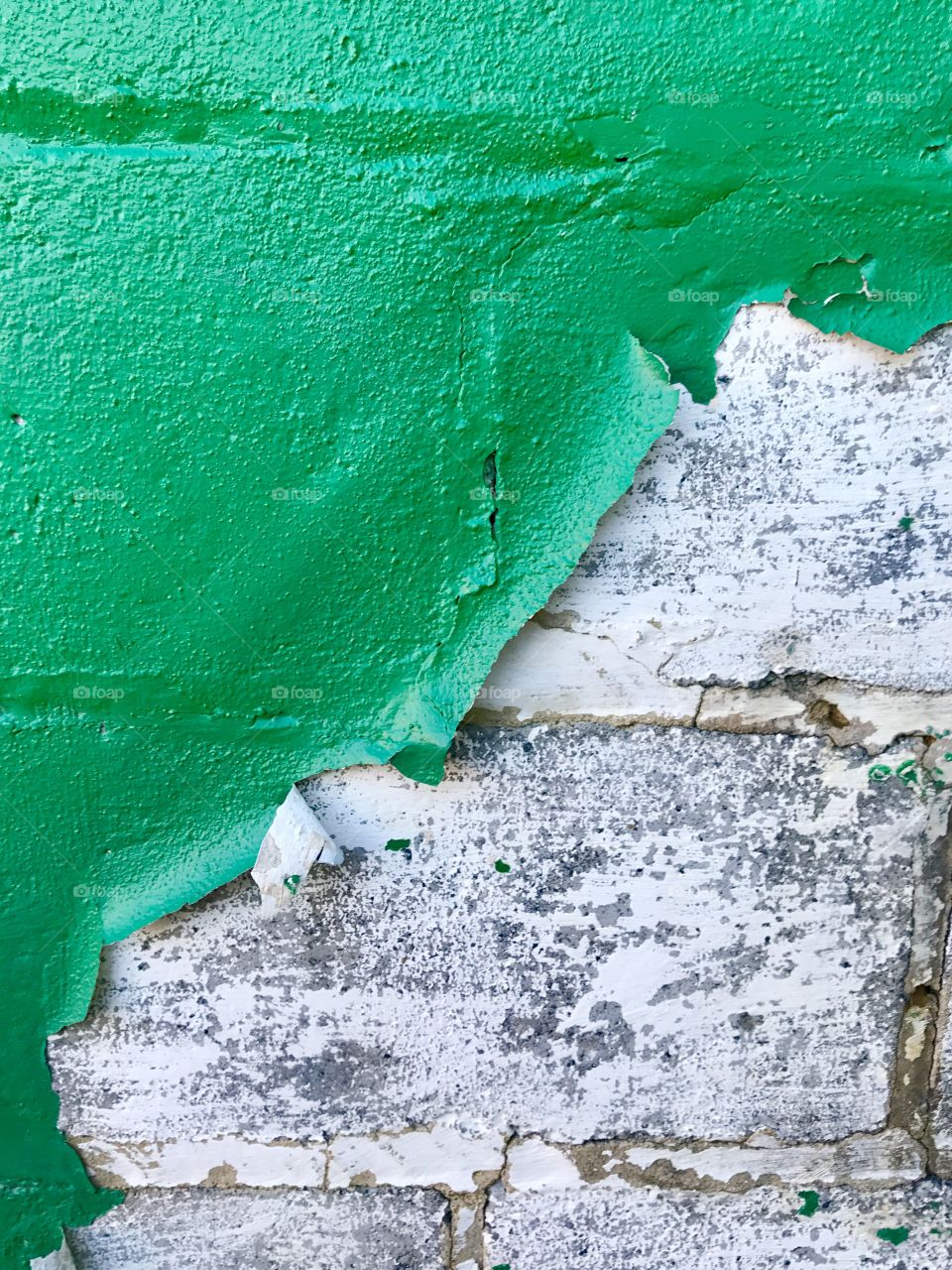 Green Paint Peeling from Stone