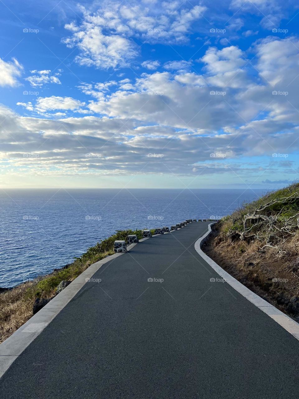 Walking down the Makapuu Point Lighthouse Trail in Waimanalo Hawaii