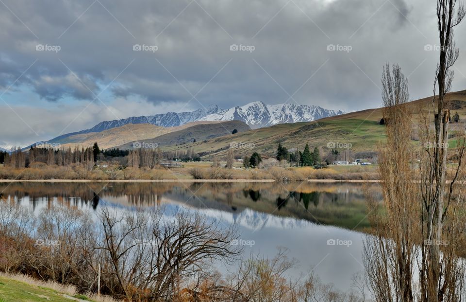Scenic view of lake and snowy mountain