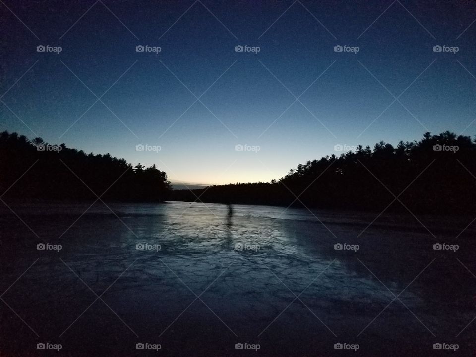 spinning and sliding on the slippery ice, skating around in the depth of the night