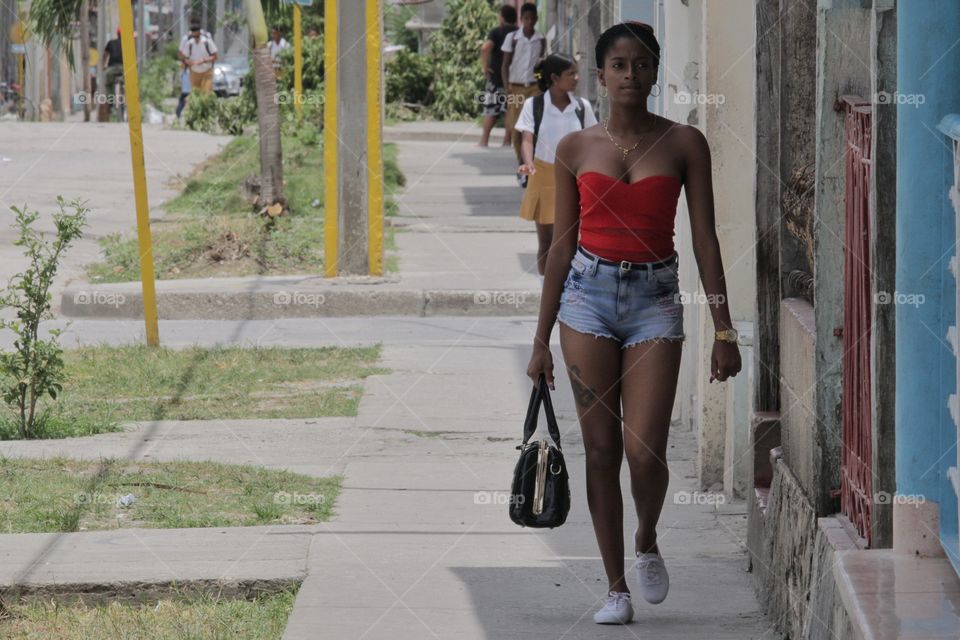 People In Cuba.Girl On Sidewalk