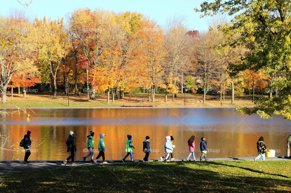 Kids walking by lake