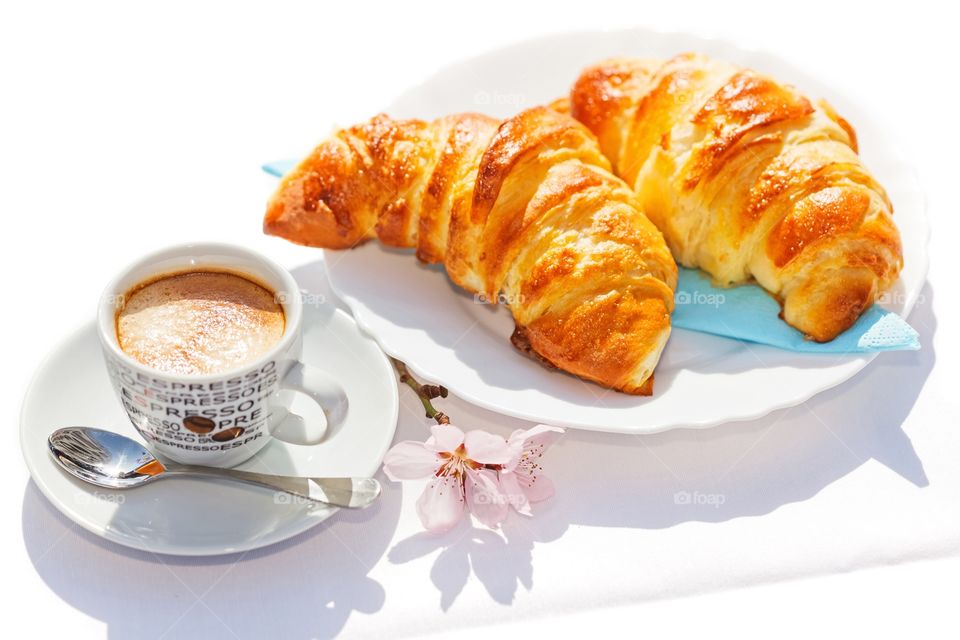 Coffee and yummy croissant for breakfast
