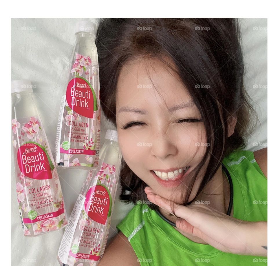 Asian lady Collagen beauti drink from Thailand 