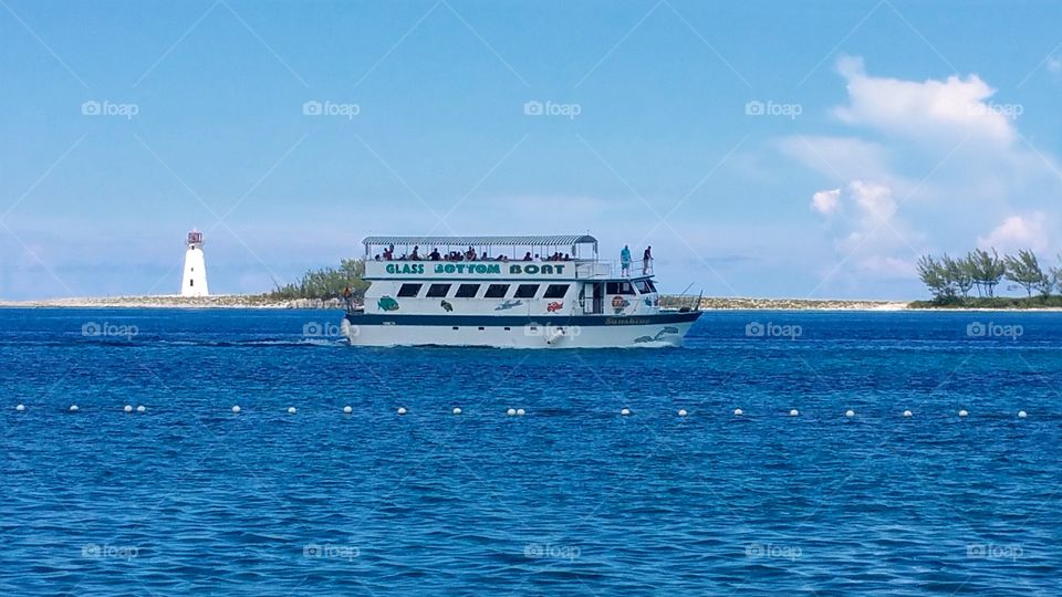 Glass bottom boat tours take you to Paradise island all day long and back Nassau Bahamas