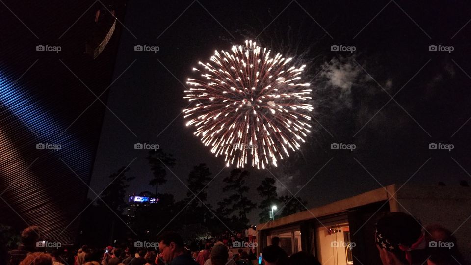 An expanded firework over an eagerly watching crowd at Miller Outdoor Theater, celebrating Independence Day, 2017.