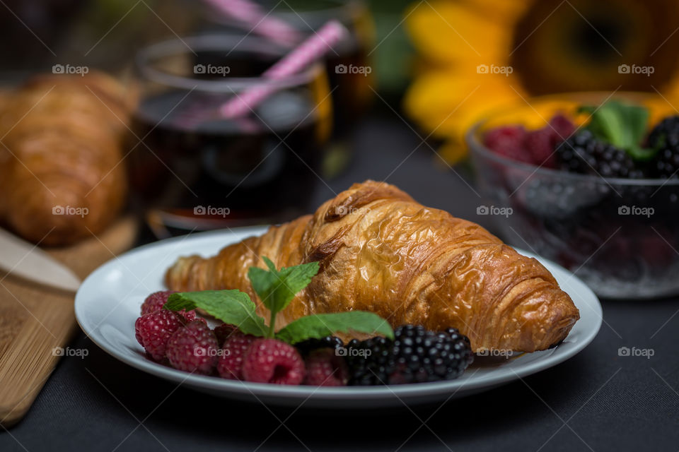 Tasty croissant in plate