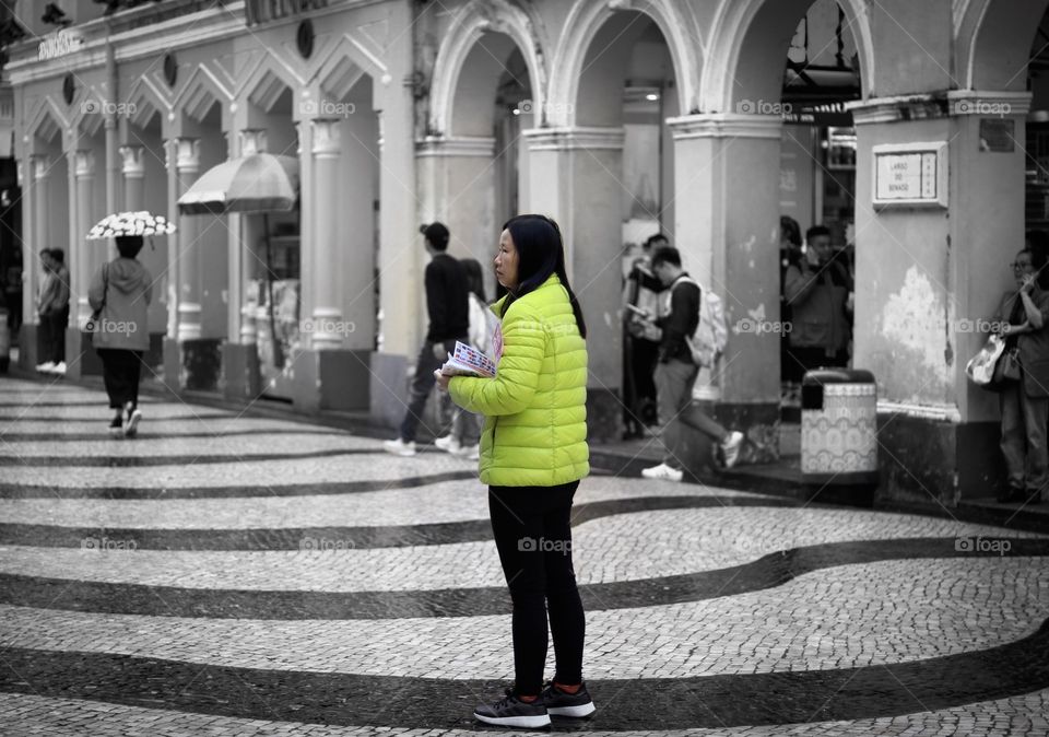 Woman in the Middle of the Street, distributing Leaflets..