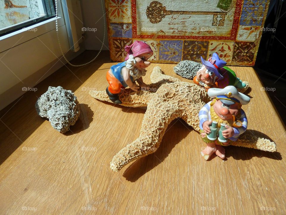 figurines on a starfish