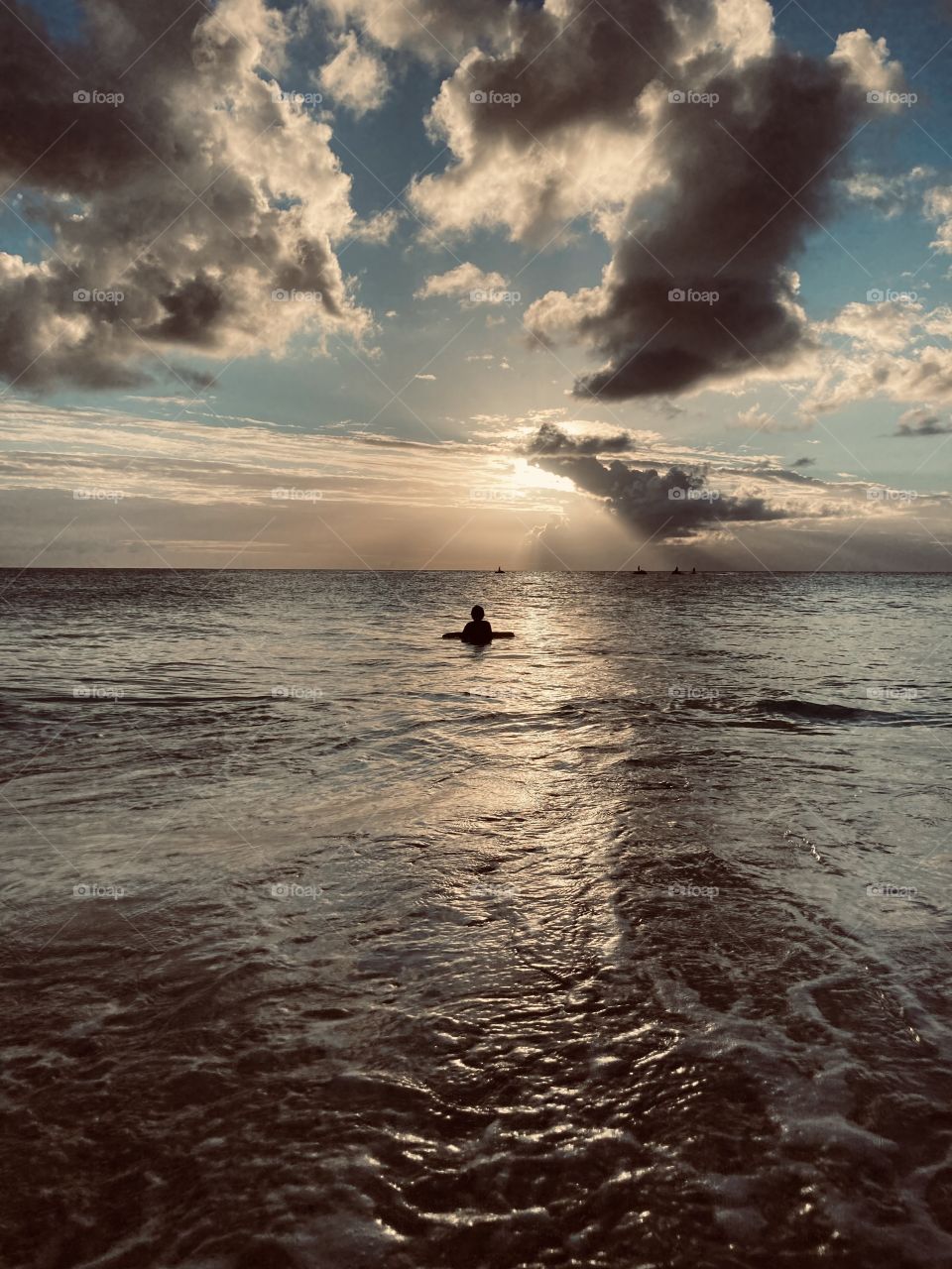 Waiting for the perfect  wave enjoying a wonderful sunset 