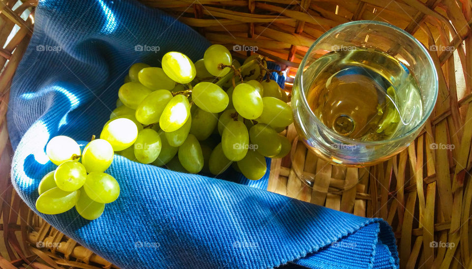 Grapes and wine in basket
