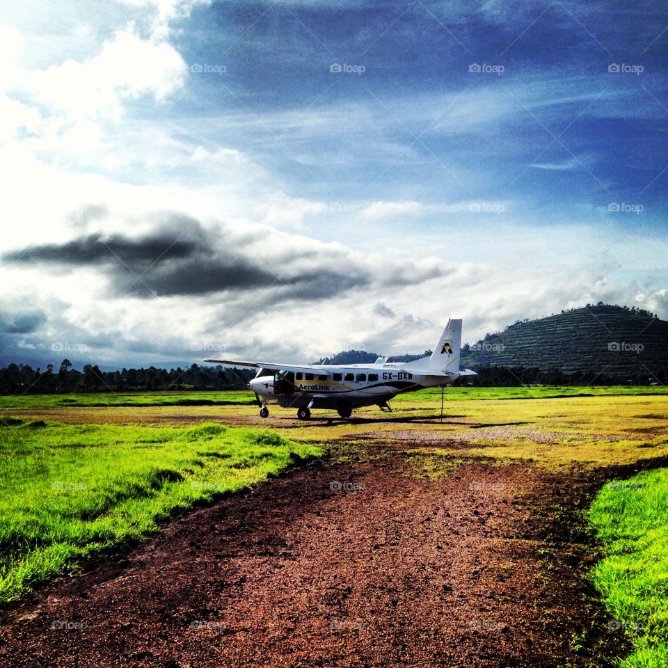 Makeshift Landing Strip Uganda. In Uganda,  flight through the "mountains" & landed on this rural runway. The pilot then says , "whew, scary landing!"