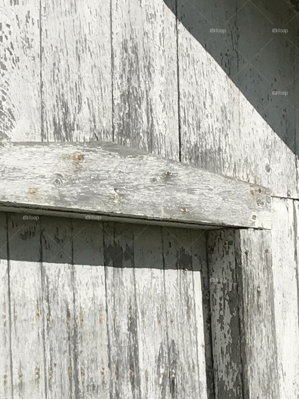 Closeup of the top of a door of a shed