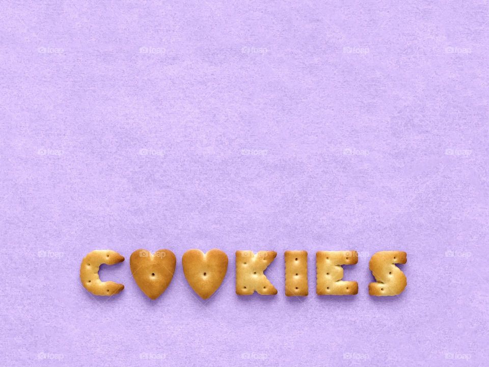 Cookies, crackers letters on purple paper 