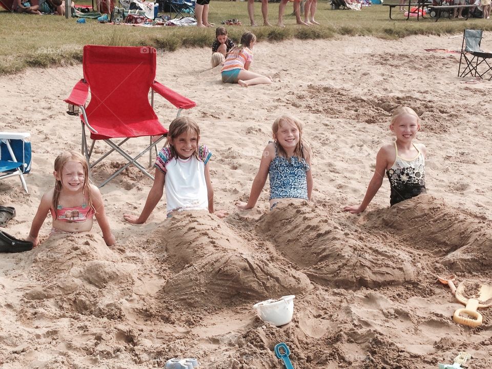 Mermaids on the beach. My daughter and a group of her friends turned themselves into mermaids while at the beach.